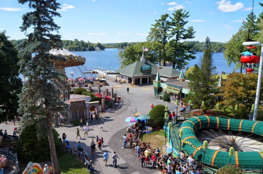 Overhead veiw of rides at Canobie Lake Park in Salem New Hampshire with a view of the lake