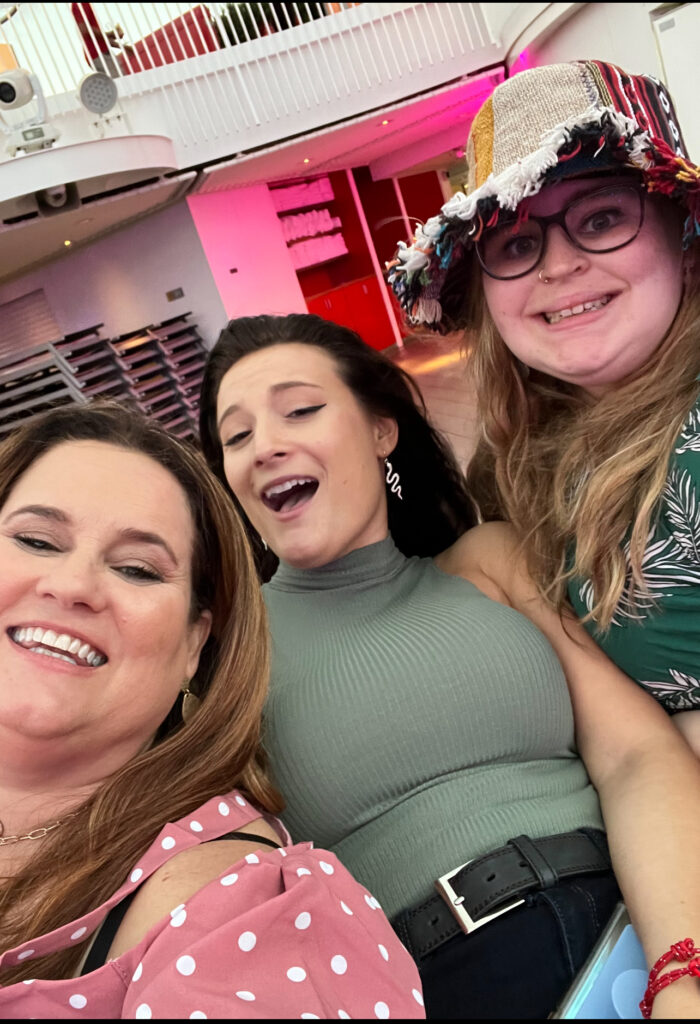 Enjoying a cruise on Virgin Voyages with two young adult daughters